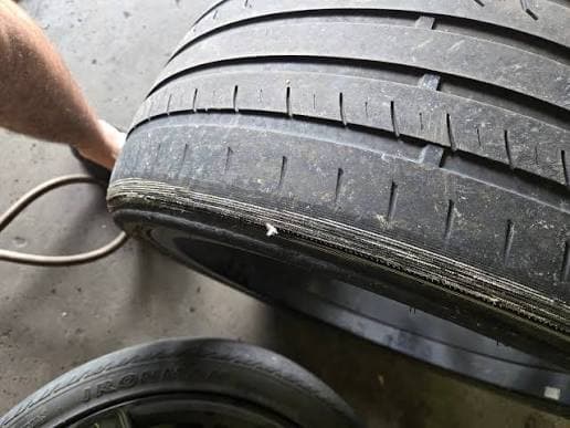 Uneven inner-shoulder tire wear from persistent misalignment