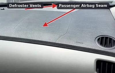 Dashboard seam showing an airbag cover replacement