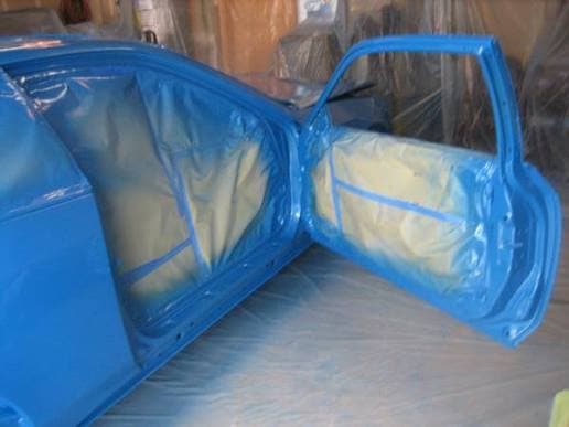Freshly painted firewall on an otherwise aged vehicle